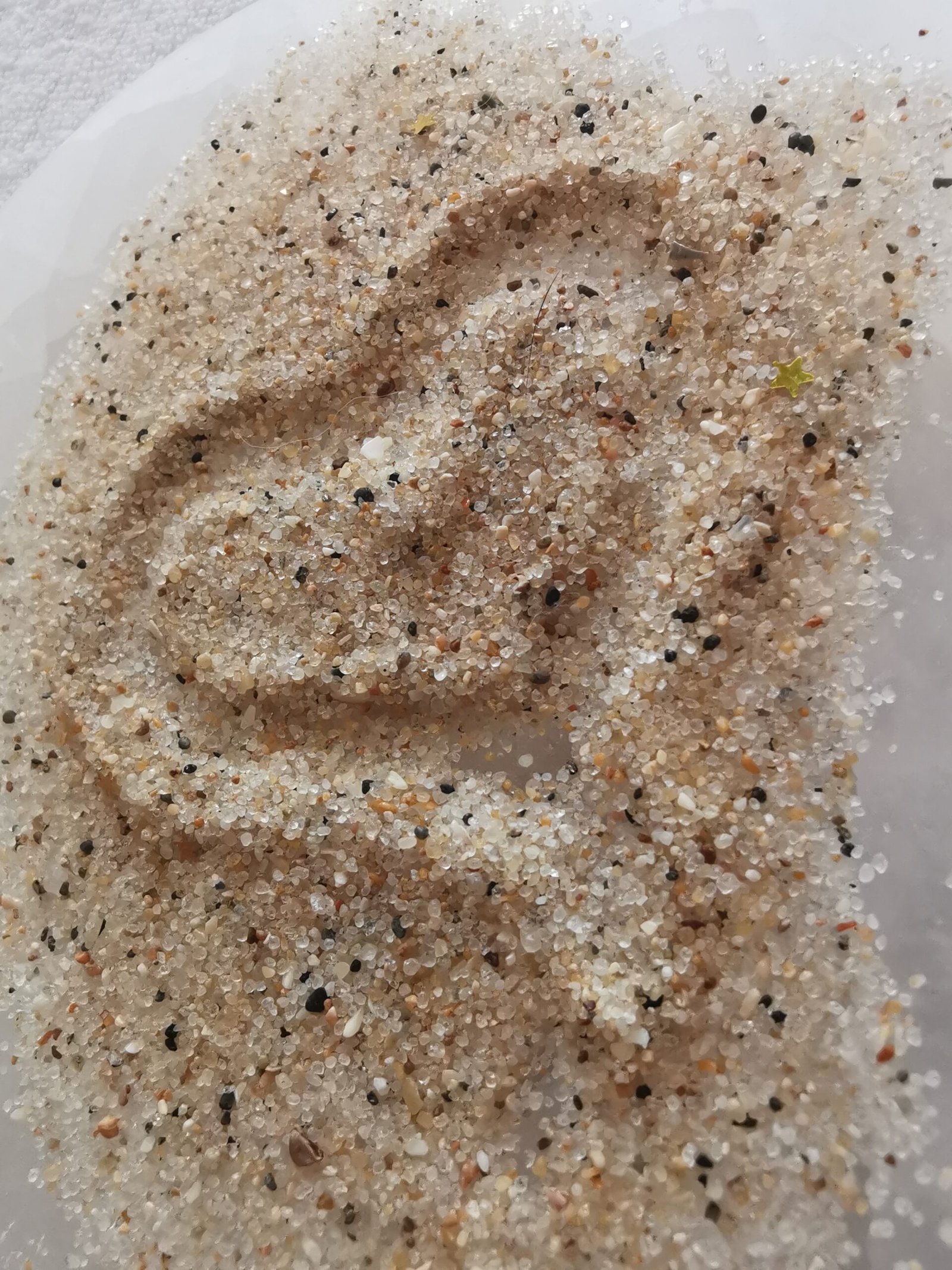 Visuel pour le Pack Cheminement présentant une image circulaire remplie de sable fin texturé. Une forme de cœur stylisée est visible au centre de la texture du sable.