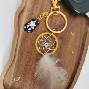 Porte-clés attrape-rêves curry avec plume et breloque chat noir et blanc